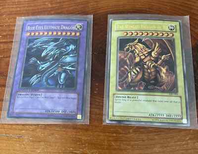 Yugioh cards The Winged Dragon of Ra and Blue Eyes Ultimate Dragon-image
